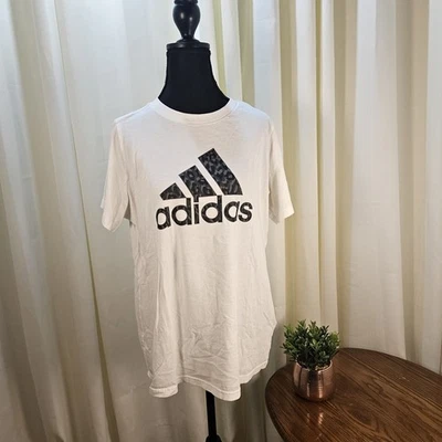 Camiseta Adidas blanca para mujer nueva sin etiquetas talla 1X con diseño de camuflaje negro/gris en logotipo Foto 1 de 4