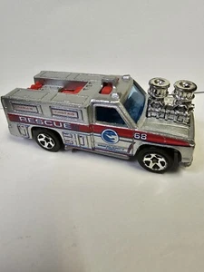 Camión de rescate Mattel Hot Wheels 1976 plateado con borde rojo - Imagen 1 de 10