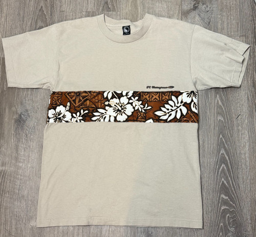 Beige Y2K VTG T&C surf shirt with brown and white floral overlay, “Y2K VTG T&C” logo on chest, USA Made.