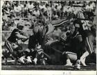 1992 Press Photo Packer Vince Workman lunges over pile on a third -and-one.