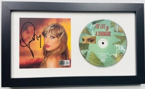 TAYLOR SWIFT SIGNED THE LIFE OF A SHOWGIRL FRAMED CD DISPLAY BECKETT HOLO J19 - Picture 1 of 3
