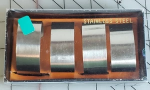 MID CENTURY EDELSTAHL SERVIETTENRINGE/HALTER 4er SET - Bild 1 von 4