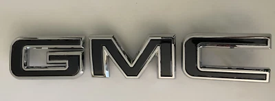 GMC 20-25 Yukon Front Emblems Dark Gray 84364382, 84364383, 84364384 OEM - Image 1 of 4