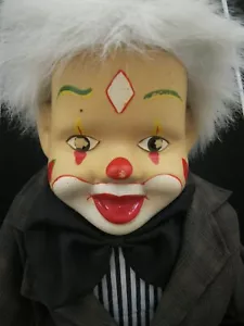 VINTAGE CLOWN DOLL HOBO DRESSED IN JACKET WITH MATCHING HAT SITTING ON A SWING - Picture 1 of 6