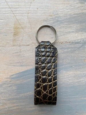 Porte-clés en crocodile noir doré - Photo 1/3