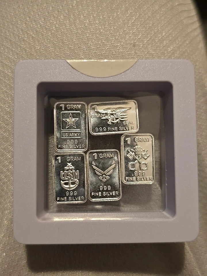 Mixed lot of FIVE (5) 1 gram silver bars 0.999 fine precious In Case Military  - Image 1 of 1