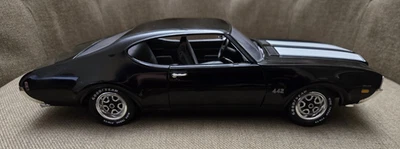 Oldsmobile 442 1969 negro escala 1:18 diecast metal coche coleccionable ERTL Foto 1 de 4