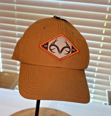 Realtree Adjustable Baseball Hat One Size Fits Most Tan 1986 Logo NWT - Image 1 of 4