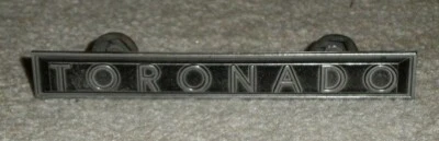 1982 - 1985 Oldsmobile Toronado Radiator Grille Name Plate 22516290 - Image 1 of 3