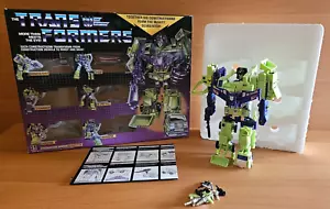 TRANSFORMERS G1 DEVASTATOR NUOVO MARCHIATO TAKARA HASBRO CON SCATOLA E MANUALI - Foto 1 di 11