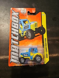 Juguete tractor Matchbox MBX Construction (2012) azul y amarillo 57/120, NUEVO - Imagen 1 de 2