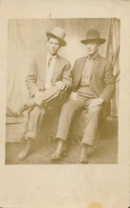 Antique RPPC Real Photo Postcard Handsome Men Young Mature Hats Leaning Tilted - Picture 1 of 5