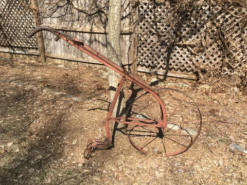Antique iron cultivator plow walk-behind farm implement Cover