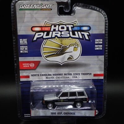 2023 GREENLIGHT 1995 JEEP CHEROKEE NORTH CAROLINA STATE TROOPER HOT PURSUIT S 43 - Image 1 of 4