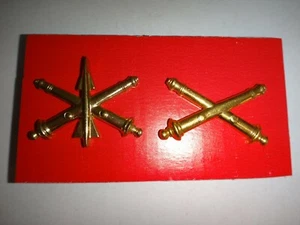 2 US Army Corps Brass Tone Metal Badges: AIR DEFENSE ARTILLERY + FIELD ARTILLERY - Picture 1 of 3