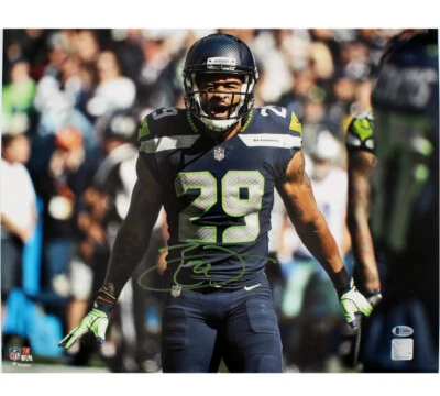 Foto firmada por Earl Thomas de los Seattle Seahawks sin marco 16x20 de la NFL - gritando con los brazos abajo Foto 1 de 3