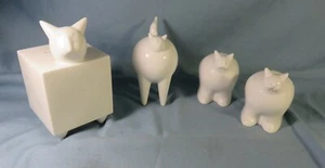 4 chats en faïence blanche de ligne très moderne: salerons, tirelire, figurine - Photo 1/7