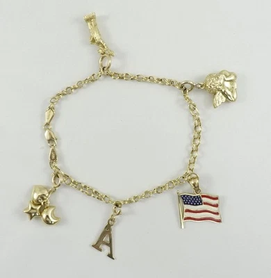 Pulsera de eslabones de cadena de oro amarillo 14K de 7,25" con 3 dijes de 14K + 2 dijes de 10K de 7g Foto 1 de 4