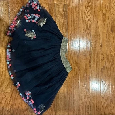 Falda niña con pompones y estrellas talla 5-6 Foto 1 de 3