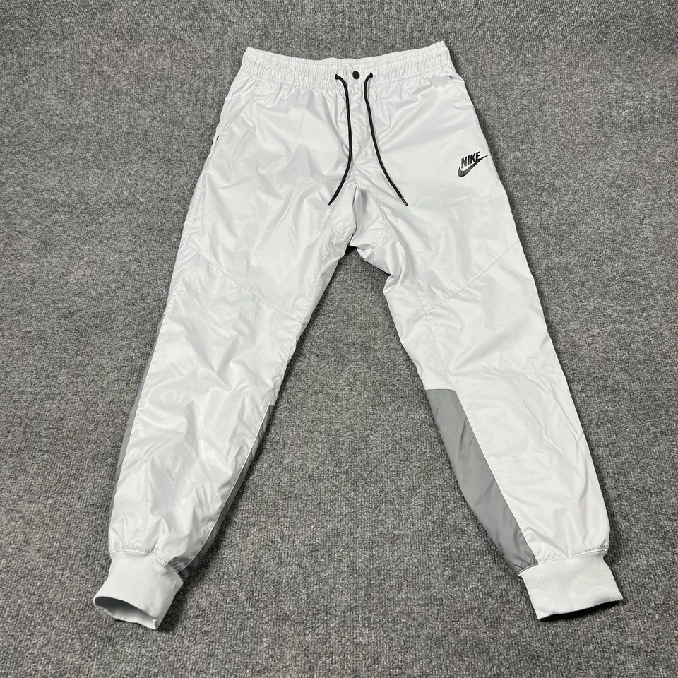 Pantalones Nike Para Hombre Medianos Plateados Reflectantes Joggers Forrados Cremallera Bolsillos Cordón Foto 1 de 4