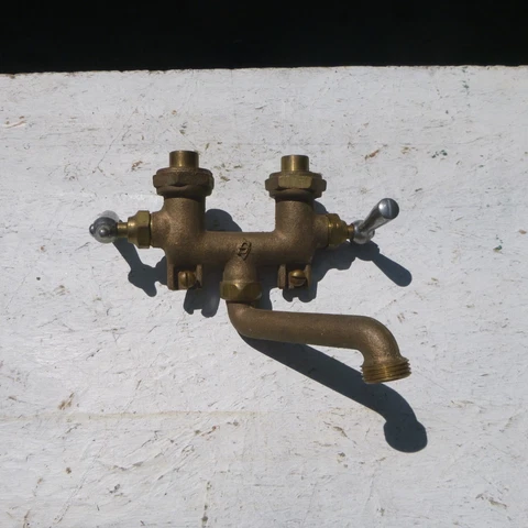 vintage cast bronze laundry tub faucet Cover