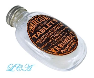 Antique WARNER CHARCOAL TABLET oval PILL BOTTLE embossed EARLY blown glass - Picture 1 of 3