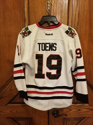 Camiseta deportiva de hockey Reebok NHL Chicago Blackhawks Jonathan Toews #19 juvenil L/XL Foto 1 de 4