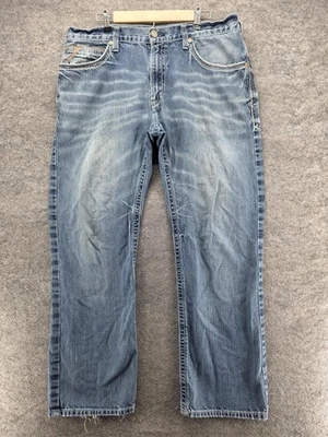 Pantalones de mezclilla Ariat 507 para hombre 38x32 azul lavado claro calce relajado desgastados deshilachados Foto 1 de 4