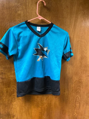 Youth "NHL" San Jose Shark short sleeve jersey. Size youth medium. prev. owned Cover