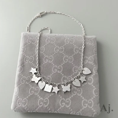 [VG] Gucci Charm Necklace Trademark Stars Butterfly Hearts Sterling Silver 925 - Image 1 of 4