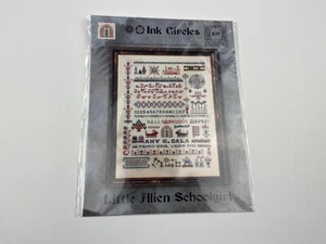 Ink circles Little Alien Schoolgirl Cross Stitch Pattern Sampler - Picture 1 of 3