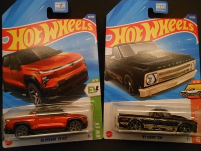 Hot Wheels 2 SET DIECAST CHEVY SILVERADO EV RST & BLACK 1967 CHEVY C10 HOT TRUCK - Image 1 of 4