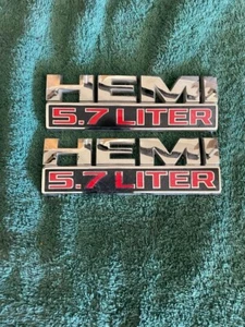 DODGE RAM HEMI 5.7 LITER SIDE EMBLEM LOGO BADGE SIGN SYMBOL USED OEM PAIR FENDER - Picture 1 of 1