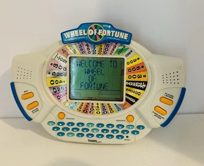 Juego LCD portátil Wheel of Fortune Deluxe Tiger Electronics 1999 probado funciona Foto 1 de 4