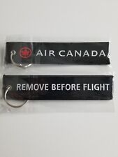AIR CANADA  AIRLINES REMOVE BEFORE FLIGHT KEY CHAIN / TAG. BLACK COLOR-NEW.