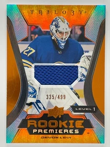 2023-24 Devon Levi Upper Deck Trilogy #143 Rookie Premieres Material 335/499 - Bild 1 von 3