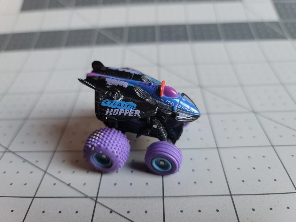 T1 MICRO MACHINES STEALTH HOPPER SPIN & STEER MONSTER TRUCK GALOOB - Image 1 of 3