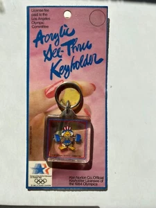 1984 Los Angeles Olympische Spiele Acryl Schlüsselanhänger Sam the Eagle Gewichtheben Neu im Karton - Bild 1 von 4