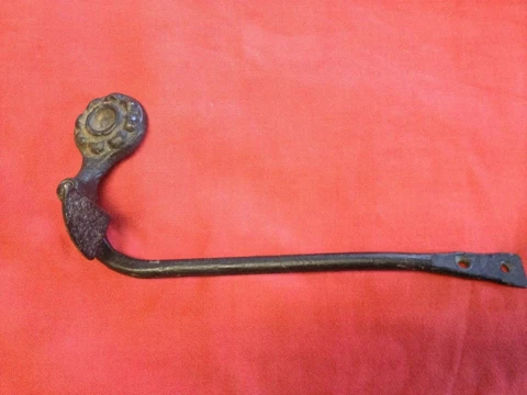 antique/vintage  hardware shutter dog--  cast - 1800's -flower  like face -black Cover