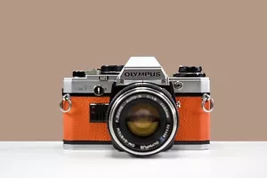 OLYMPUS OM10 35mm Film Camera w/ 50mm f/1.8 Zuiko Lens & Manual Adapter - Picture 1 of 7