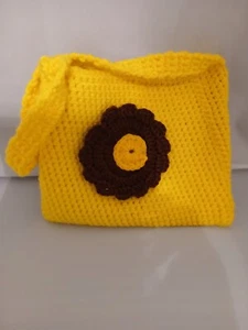Child's crocheted purse with brown and yellow flower. - Picture 1 of 2