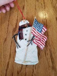 SNOWMAN ORNAMENT patriotic with scarf and holding American Flag "snowy" effect - Picture 1 of 6