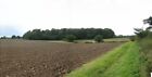 Photo 6x4 Ploughed field with view towards Larn's Loke Plantation (Take 2 c2007