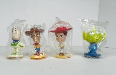 Juego de 4 cabezas bobble Toy Story de Disney Pixar Kellogg's nuevo Woody Buzz Jessie Alien Foto 1 de 4