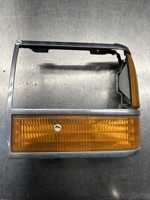 1989-1992 FORD RANGER BRONCO II LEFT HEAD LIGHT BEZEL TRIM W/TURN SIGNAL OEM Foto 1 de 3