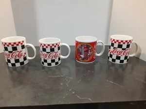 Coca Cola Mugs. 4 total mugs 3 from 2000 and 1 from 1995 - Picture 1 of 4