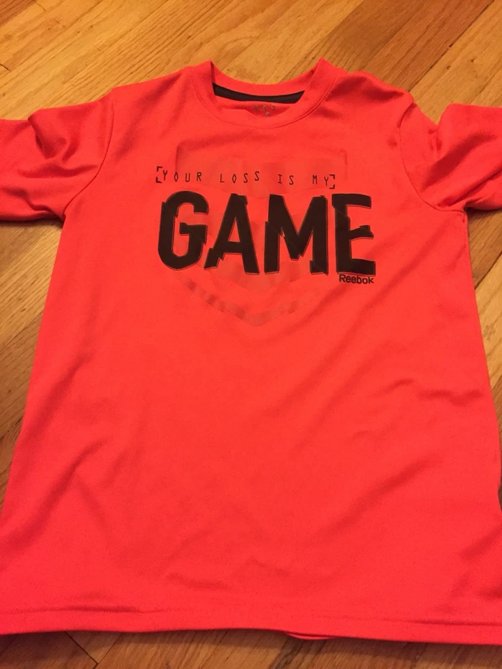 Camiseta Reebok Manga Corta Naranja Neón Niñas - Talla Pequeña (8-10) (GUC) Foto 1 de 2