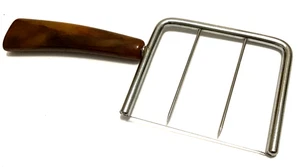 Vintage Stainless Steel Wire Cheese Slicer w Butterscotch Swirl Bakelite Handle - Picture 1 of 4