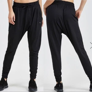 Nike Flow Lux schwarz Baggy High Rise Tapered Activewear Hose 933668-010 Medium - Bild 1 von 10