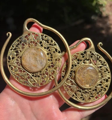 diablo organic rutilated quartz  brass ear weights - Image 1 of 3